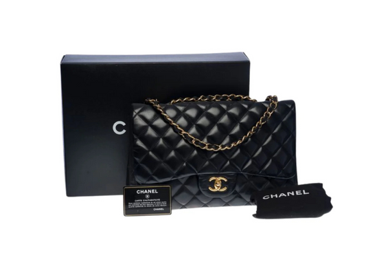 Chanel Classic Jumbo flap bag in black lambskin leather with gold hardware and original box and dust bag.