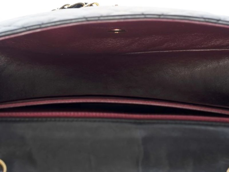 Interior view of the Chanel Classic Jumbo flap bag showcasing soft leather lining and organizational compartments.