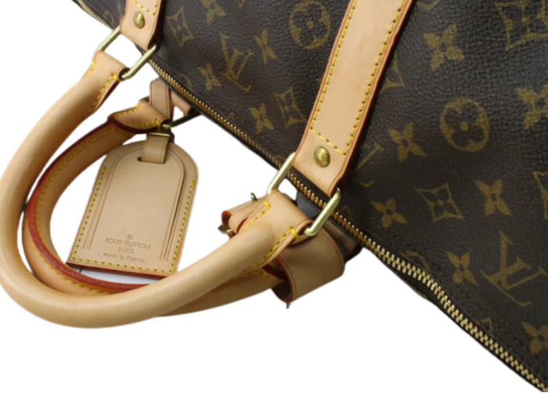 Louis Vuitton Keepall Bandoulière – læderdetaljer og håndtag i naturlig vachetta-læder