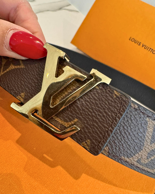 Louis Vuitton Reversible Belt with gold LV buckle and Monogram Canvas, featuring elegant black leather.