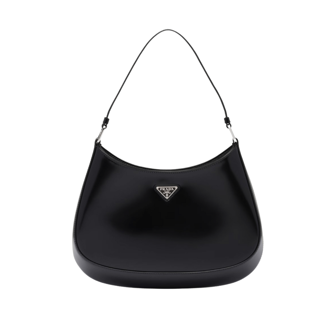 Elegant black Prada handbag with iconic logo, showcasing timeless luxury and Italian craftsmanship.