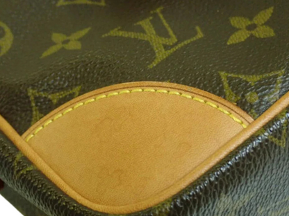 Detail of Louis Vuitton Trocadero 27 showcasing the monogram canvas and Vachetta leather trim.