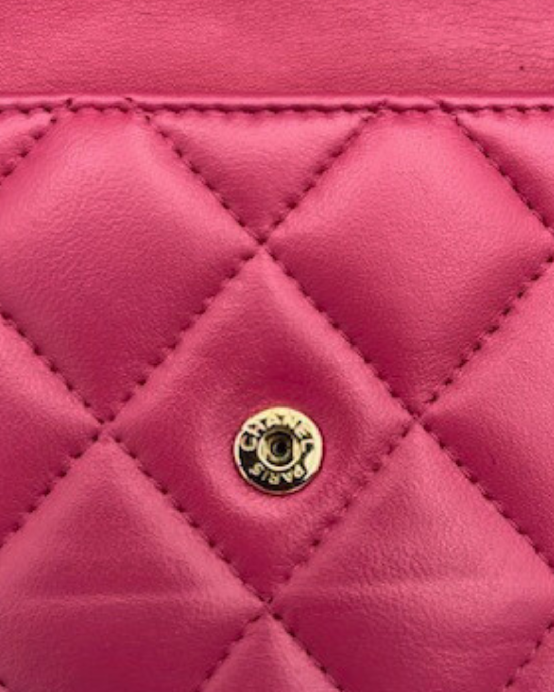 Vintage Chanel Classic Flap Pung quilted design in deep raspberry pink with signature logo detail.